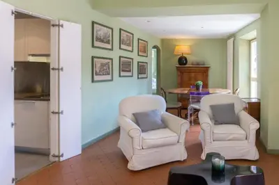 a living room with two chairs and a table at EasyTopStay - Piazza Venezia Charming & Bright Apt in Rome