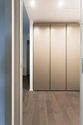 an empty corridor with sliding doors in a building at EasyTopStay - Stylish Flat with Garden in Rome