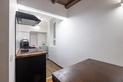 a kitchen with a sink and a wooden counter top at woodstyle apartment - navona in Rome