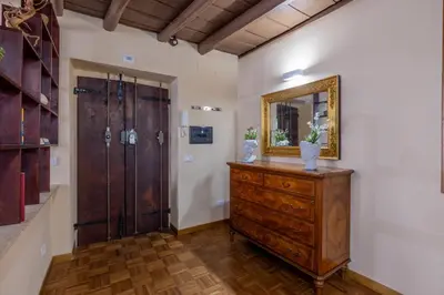 a bathroom with a wooden dresser and a mirror at woodstyle apartment - navona in Rome
