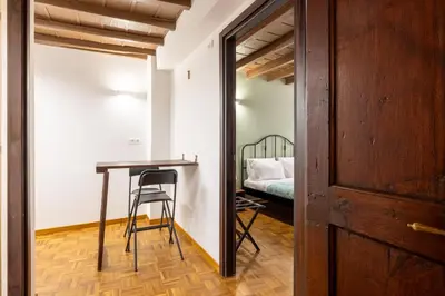 a room with a desk and a bed at woodstyle apartment - navona in Rome