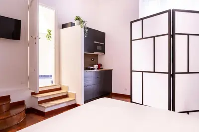 a bedroom with a bed and a window at Casa Salandra by Hili in Rome