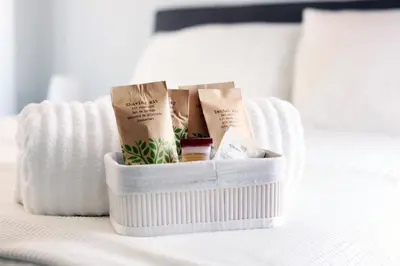 a white container on a bed with someonessenalsenalsenalsenalsenal at VATICAN HOME ROMA in Rome