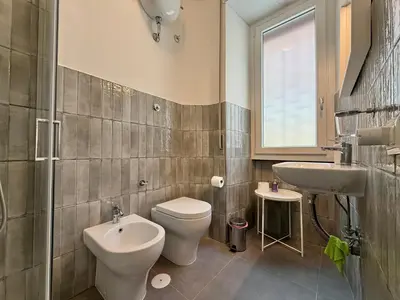 a bathroom with a toilet and a sink at Ottaviano - 10 min dal Vaticano in Rome