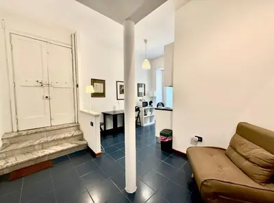 a living room with a couch and a table at Ottaviano - 10 min dal Vaticano in Rome