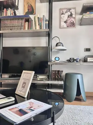 a bedroom with a bed and a desk and a television at VATICAN GLAMOROUS at Passeggiata del gelsomino - FREE Parking, 4 Guests, Central Rome in Rome