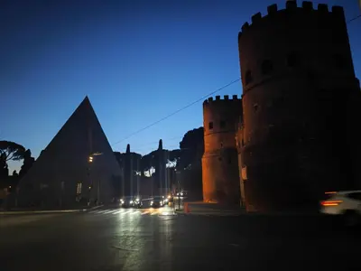 a night view of a street with a castle at Brando Apartment in Rome