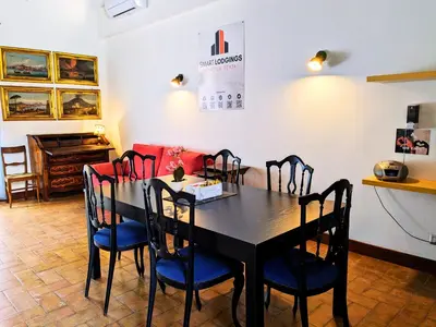 a dining room with a table and chairs at Smart Lodging Prime in Rome