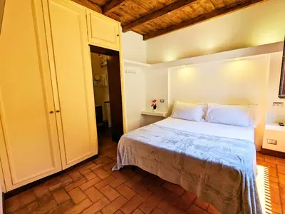 a bedroom with a large bed in a room at Smart Lodging Prime in Rome