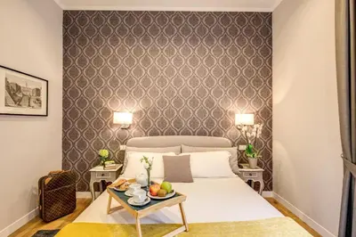 a bedroom with a bed and a table with fruit on it at TLV Navona in Rome