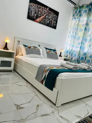 a bedroom with a white bed with at Suite San Damaso in Rome