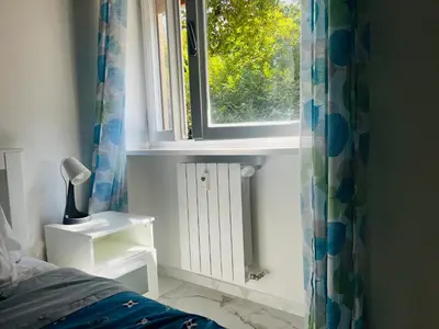 a window in a bedroom with a bed and a windowgiene at Suite San Damaso in Rome