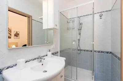 a bathroom with a sink and a shower at Turati by Rental in Rome in Rome