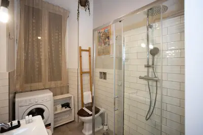 a bathroom with a shower and a toilet and a sink at Persia Collection Colosseo in Rome
