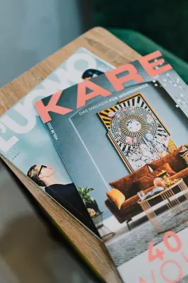 a magazine sitting on top of a table at Persia Collection Colosseo in Rome