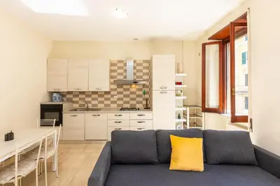 a living room with a couch and a kitchen at Vatican Museum by Rental in Rome in Rome