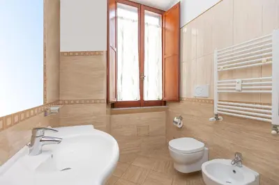 a bathroom with a white sink and a toilet at Vatican Museum by Rental in Rome in Rome