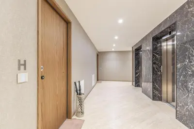 a hallway with a door and a vase at Luxury Trastevere gym & rooftop 5H in Rome