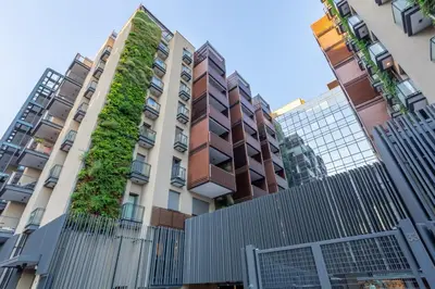 an apartment building with a vertical garden on it at Luxury Trastevere gym & rooftop 5H in Rome