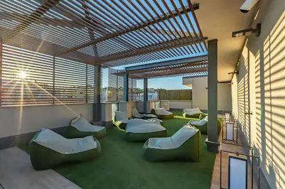 a waiting room with chairs and windows at Luxury Trastevere gym & rooftop 5H in Rome