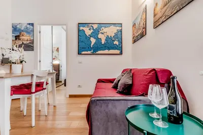 a living room with a couch and a table at BBHOME Elegant apartment at Saint Peter front of Vatican in Rome