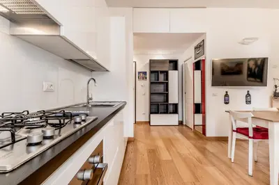 a kitchen with a stove and a counter top at BBHOME Elegant apartment at Saint Peter front of Vatican in Rome