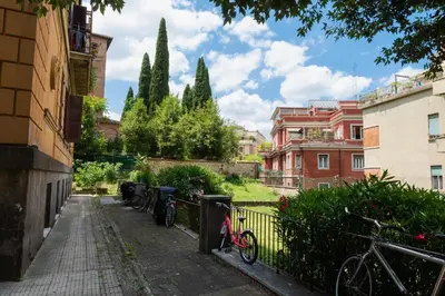 a group of bikes parked next to a fence at Borghese Magnolia Suite in Rome