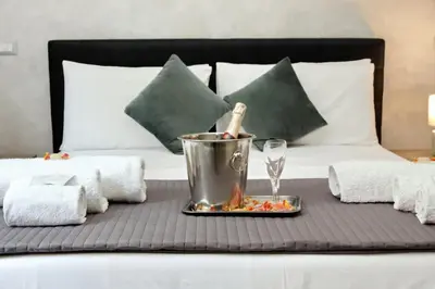 a tray of food on a table on a bed at Domus Gallo Guest House in Rome