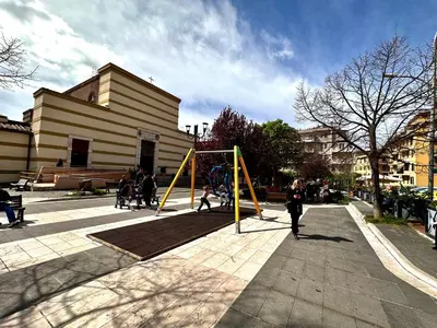 a group of people playing on a playground at Trastevere Gianicolense casa con giardino in Rome