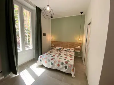 a bedroom with a bed with a comforter on it at Laura Apartment in Rome