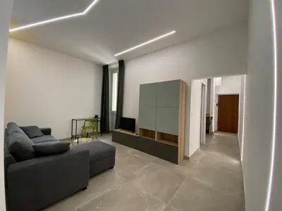a living room with a couch and a television at Laura Apartment in Rome