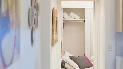 a room with a closet with a couch in it at Consulta By Rental In Rome in Rome