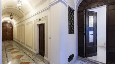 a corridor of a building with a door at Consulta By Rental In Rome in Rome