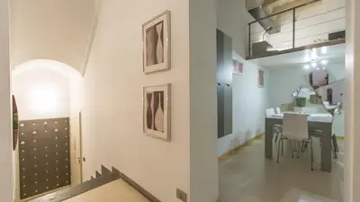 a room with a table and a dining room at Rental in Rome Purificazione apartament in Rome