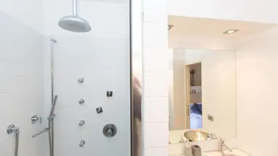 a bathroom with a shower and a sink and a mirror at Rental in Rome Purificazione apartament in Rome