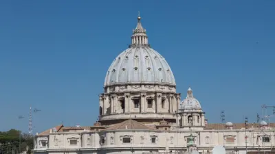 a building with a dome on top of it at Quirinale by Rental in Rome in Rome
