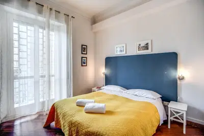 a bedroom with a large bed with two towels on it at Circus Maximus B&B in Rome