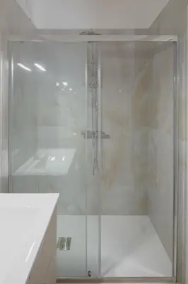 a glass shower in a bathroom with a sink at Gianicolense 22 in Rome