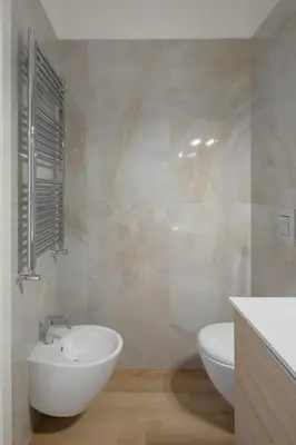a bathroom with a white sink and a toilet at Gianicolense 22 in Rome