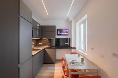 a kitchen with a table and a dining room at Gianicolense 22 in Rome
