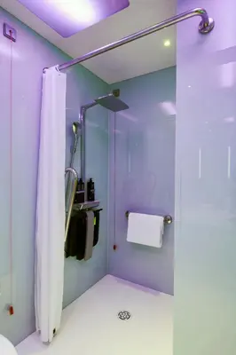 a window with a blind in a room at citizenM Rome Isola Tiberina in Rome