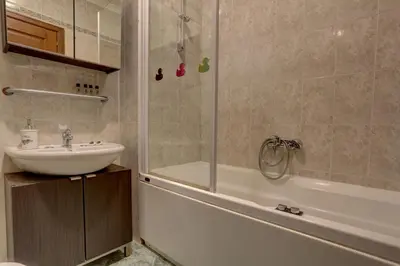 a bathroom with a sink and a shower and a tub at Colosseo Apt Mecenate 77 - Home and More in Rome