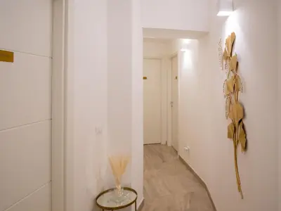a living room with tables and chairs and a couch at Alto Apartment in Rome