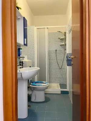 a bathroom with a sink and a toilet and a shower at h135 in Rome