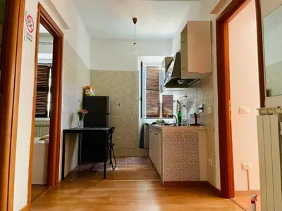 a small kitchen with a sink and a refrigerator at h135 in Rome