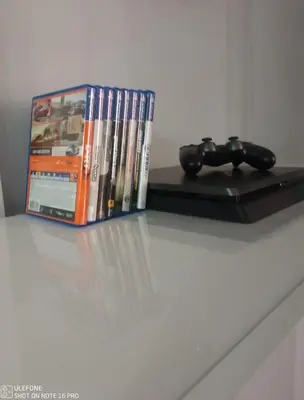 a group of dvds and a remote control on a table at Delizioso appartamento in Rome