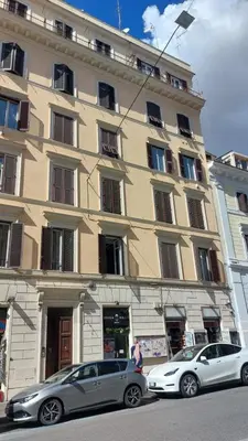 two cars parked in front of a building at Loft 133 - Central and Luxury Loft in Rome in Rome
