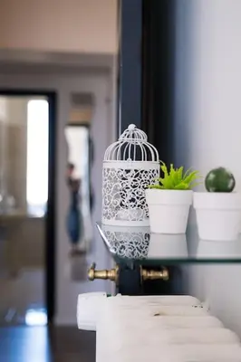 a bird cage sitting on top of a table at Appartamento San Giovanni Liliana in Rome
