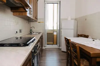 a kitchen with a sink and a counter top at Appartamento San Giovanni Liliana in Rome