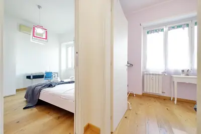 a white room with a bed and a window at 4BNB - Trionfale Apartment in Rome